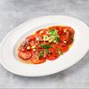 Фото к позиции меню Карпаччо из томатов и печеного перца с трюфельным понзу