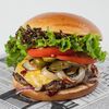 Фото к позиции меню Бургер с говяжьей котлетой, беконом и соусом барбекю