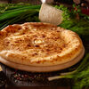 Фото к позиции меню Пирог с осетинским сыром и зеленью