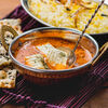 Фото к позиции меню Панир масала - нежный сыр в пряном томатном соусе с рисом басмати и лепешкой наан
