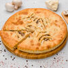 Фото к позиции меню Осетинский пирог с курицей, сыром и грибами