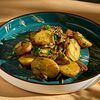 Фото к позиции меню Беби картофель с лесными грибами и жареным луком