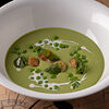 Фото к позиции меню Крем-суп из зеленого горошка с гребешком и трюфельным маслом