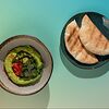 Фото к позиции меню Хумус из зеленого горошка с питой и овощным салатом
