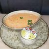 Фото к позиции меню Суп Том Ям с королевскими креветками и цыпленком