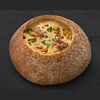 Фото к позиции меню Суп сырный в хлебной чаше