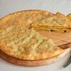 Фото к позиции меню Пирог осетинский с картофелем и зелёным луком