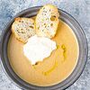 Фото к позиции меню Грибной крем суп с трюфельным маслом и хрустящей гренкой