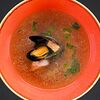Фото к позиции меню Прозрачный суп из рыбы и морепродуктов