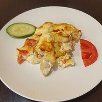 Минтай запеченный под сыром с овощами