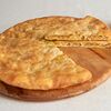 Фото к позиции меню Пирог осетинский с капустой, сыром и сливками