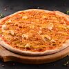 Фото к позиции меню Пицца Сочное филе курочки в соусе карри на тонком тесте