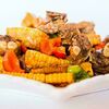 Фото к позиции меню Ребрышки с кукурузой и овощами