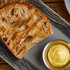 Фото к позиции меню Тосты из деревенского хлеба с чесночным маслом