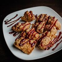 Крылья в панировке пол соусом sweet chilli