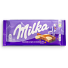 Фото к позиции меню Шоколад Milka молочный с белым шоколадом