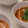 Фото к позиции меню Пряный томатный суп с кокосовым молоком