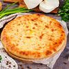 Фото к позиции меню Осетинский пирог с сыром и зеленым луком