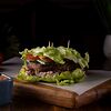 Фото к позиции меню Бургер в листьях с котлетой из растительного мяса