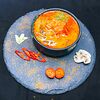 Фото к позиции меню Тайский острый суп Том Ям с лососем