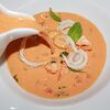 Фото к позиции меню Сливочно-томатный суп с морепродуктами
