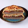 Фото к позиции меню Хачапури-бургер с котлетой из говядины, помидором и сыром сулугуни