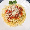 Фото к позиции меню Спагетти с овощами и курицей под сыром