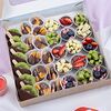 Фото к позиции меню Набор из фруктов, конфет и ягод в шоколаде Ноты Весны
