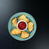 Фото к позиции меню Кусочки куриного филе в хрустящей панировке с кетчупом