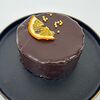 Фото к позиции меню Бенто-торт Шоколадный с кокосом, манго и апельсином