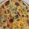 Фото к позиции меню Осетинский пирог с сыром и зеленью