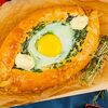 Фото к позиции меню Хачапури со шпинатом, сыром и яйцом