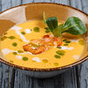 Фото к позиции меню Тыквенный крем-суп с креветками и кокосывыми сливками
