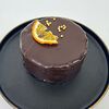 Фото к позиции меню Бенто-торт Шоколадный с кокосом, манго и апельсином