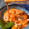 Фото к позиции меню Марсельский рыбный суп с лососем домашнего копчения, креветками и вонголе