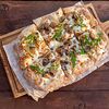 Фото к позиции меню Пицца с грибами, пармезаном и трюфельным маслом