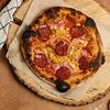 Фото к позиции меню Неаполитанская пицца Карне