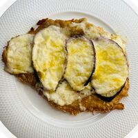 Отбивная свиная с овощами под сыром