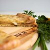 Фото к позиции меню Пирог осетинский с сыром и свекольными листьями