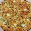 Фото к позиции меню Пицца на тонком тесте Четыре сыра