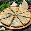Фото к позиции меню Осетинский пирог с сыром, зеленью и шпинатом 30 см