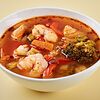 Фото к позиции меню Пряный томатный суп с морепродуктами