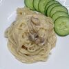 Фото к позиции меню Спагетти с шампиньонами в сырном соусе