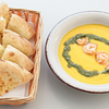 Фото к позиции меню Тыквенный крем суп с креветкой и песто