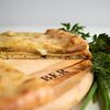 Фото к позиции меню Пирог осетинский с сыром и зеленью