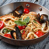 Фото к позиции меню Спагетти с морепродуктами с томатами черри в легком винном соусе