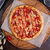 Фото к позиции меню Пицца с ветчиной и томатами мини