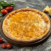 Фото к позиции меню Пицца Четыре сыра на томатной основе