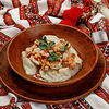 Фото к позиции меню Вареники с картофелем, шпиком, жареным луком и копченой грудинкой
