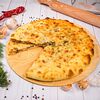 Фото к позиции меню Пирог с осетинским сыром и свекольной ботвой